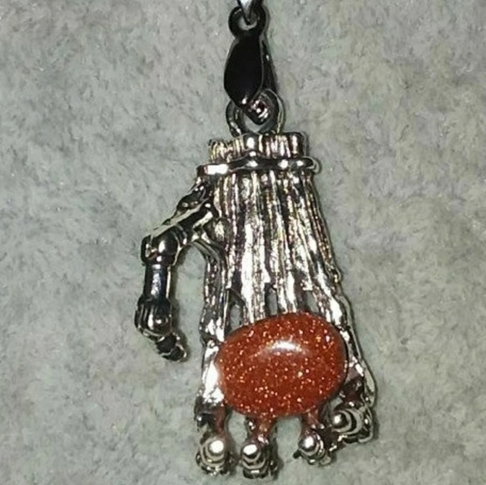 CREEPY SKELETONS HAND W/SANDSTONE